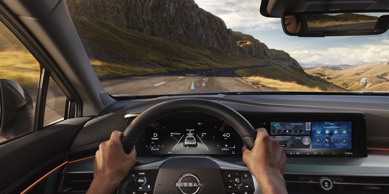 View from the driver's point of view of the steering wheel and heads up display in the Nissan Armada