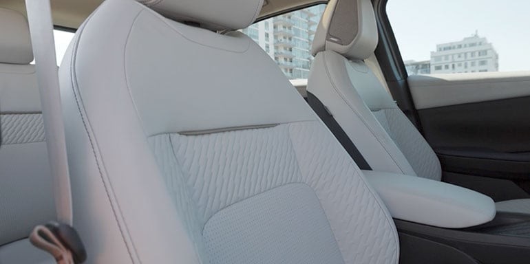 2026 Nissan Leaf interior showing Bose Personal audio system with headrest speakers