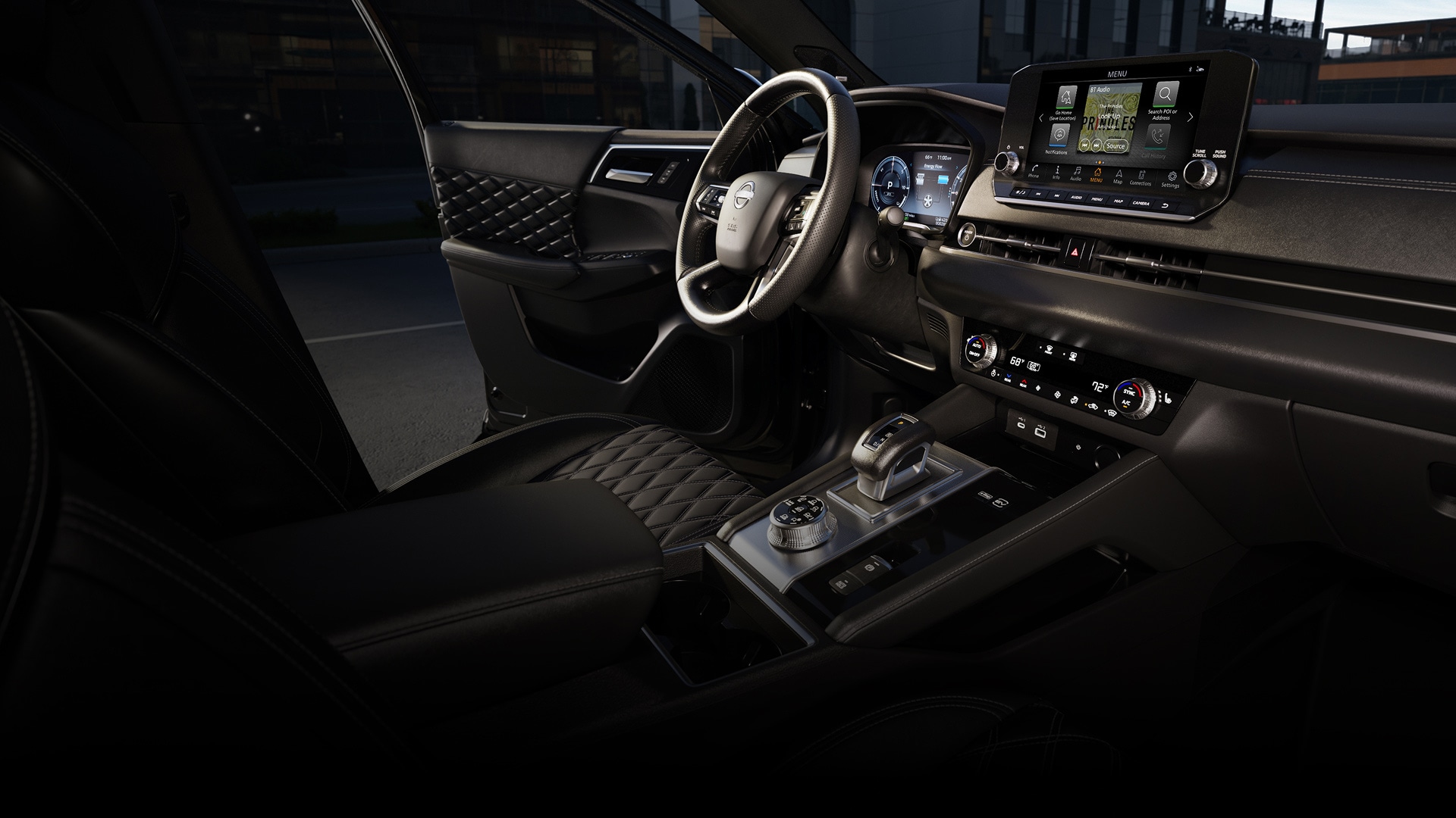 2026 Nissan Rogue Plug-in Hybrid interior view of the dashbaord and headunit as seen from outside the passenger side window.