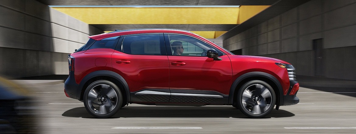 2027 Nissan Kicks driving through a concrete structure