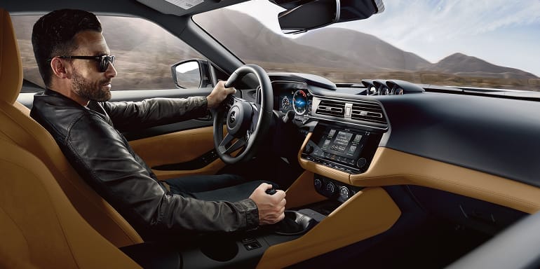 2027 Nissan Z driver in cockpit with black and tan interior.